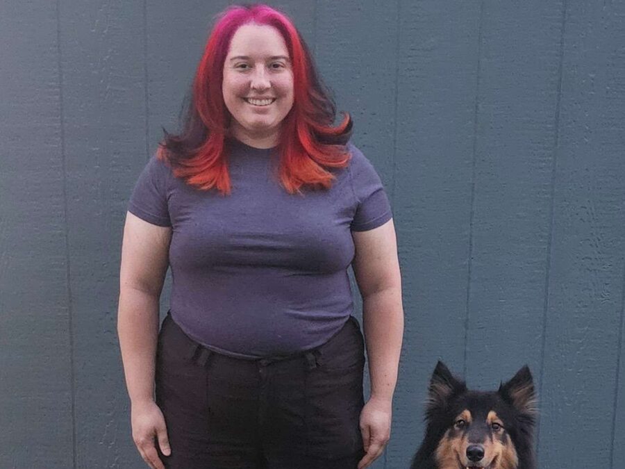 Zelina with two dogs she trains